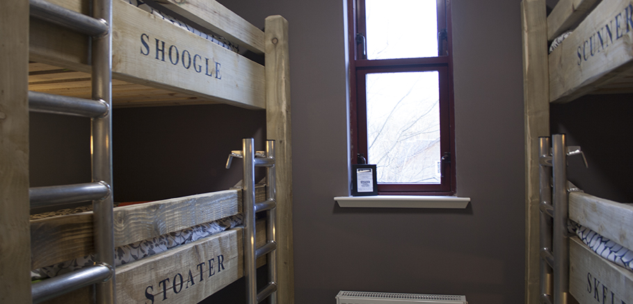 Local timber supplied by sawmill to make bunks with text branded into the wood