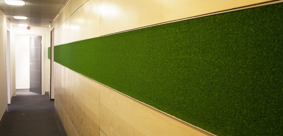 Astroturf and maple veneer combined as a wall finish